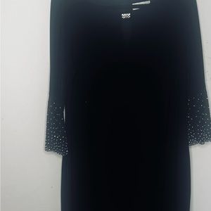Used. Like new. Black midi dress. Jackie Jon New York. Size: 14. M
